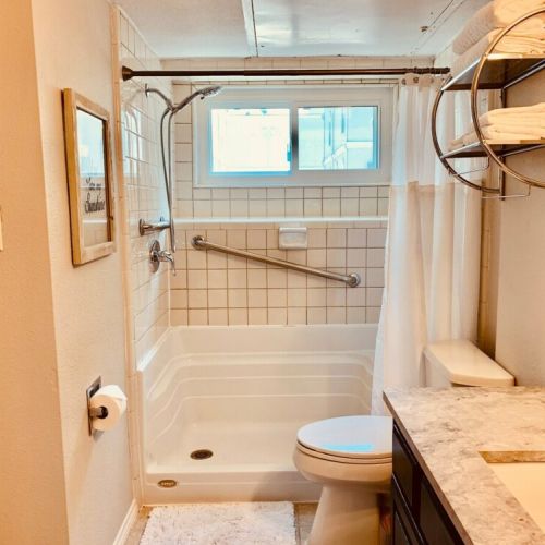 Full bath with updated quartz counter
