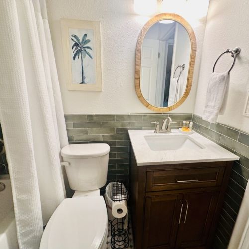 Bathroom located between 2 bedrooms