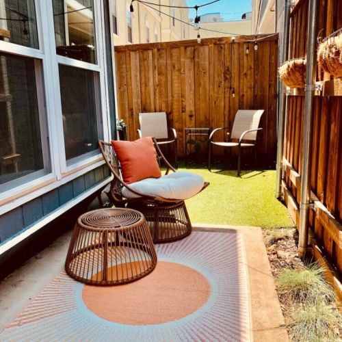 Cute outdoor porch with high privacy fence